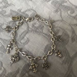 Brighton 8” cross charm bracelet. Silver w/gold on a few charms.